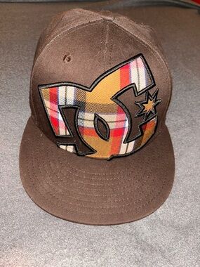 2010s men’s New Era brown plaid DC Shoe Skate boarding hat. Size 7 1/4.